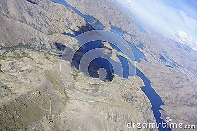 Aerial lake view of Canterbury landscape through perspex canopy from within glider cockpit in flight Stock Photo