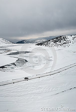 Aerial landscape with a car on the winter road Stock Photo