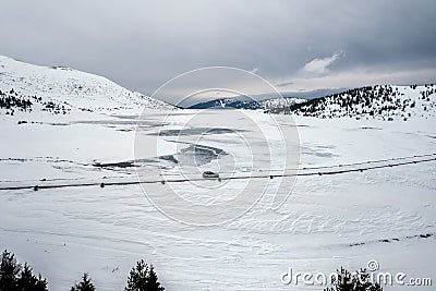 Aerial landscape with a car on the winter road Stock Photo