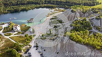 Aerial landscape Sand Hills of Quarry With a Pond and Abandoned Prison in Rummu Estonia Europe. Stock Photo