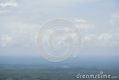 Aerial landscape view with a drone of meadow and cloudy sky horizon. Beautiful natural view of green fields and sky. Foggy weather Stock Photo