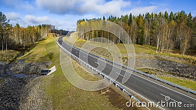 Aerial landscape view of empty rural road in beautiful autumn forest Stock Photo