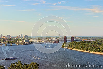 Aerial landscape view of Kyiv at summer sunny day. Beautiful Dnipro River with bridges and Obolon district at the background. Editorial Stock Photo