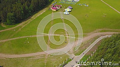 Aerial Large group of beautiful kids boys and girls running with kids in the park. Kite Carefree Activity Summer Joyful Stock Photo