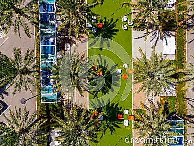 Aerial overhead drone photo of a relaxation patio with palms and furniture Stock Photo