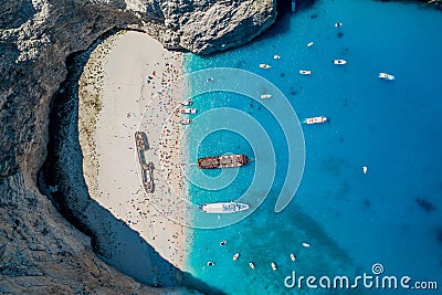 Aerial overhead drone shot of Zakynthos Navagio beach with tourists ,cruise ship and yachts Stock Photo