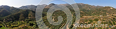 Aerial panorama of cretan landscape with Olive groves on mountain slopes. Crete, Greece Stock Photo