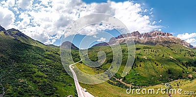 Aerial panorama view of the road for travelers on a motorcycle, car, incredible beauty views of green meadows and majestic Stock Photo