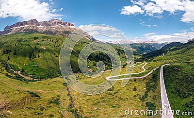 Aerial panorama view of the road for travelers on a motorcycle, car, incredible beauty views of green meadows and majestic Stock Photo