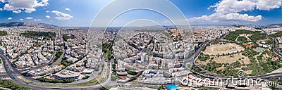 Aerial panoramic drone shot of Athens center with Oplymion Site, Lycabettus hill, acropolis Stock Photo