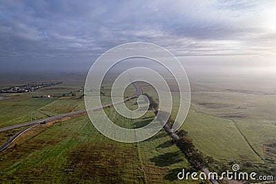 Aerial panoramic foggy sunrise view of Alentejo countryside farmlands, shot near Castro Verde village in Alentejo region, a Stock Photo