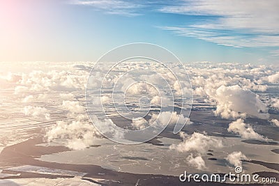 Aerial panoramic landscape view of earth with frozen lake and field. Cloudscape skyline photo from plane landing in austrian Stock Photo