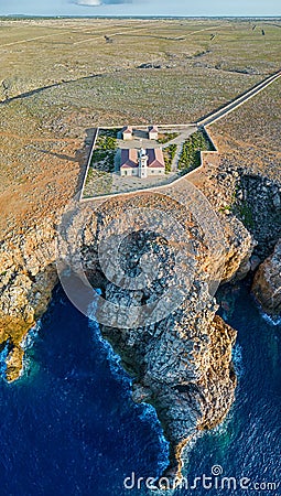 Aerial panoramic view of Punta Nati Lighthouse at north coast of Menorca Stock Photo