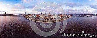 Aerial panoramic view to histirical center Riga, quay of river Daugava. Famous Landmark - st. Peter`s Church`s tower and Stock Photo