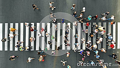 Aerial. People crowd. Many people going through the pedestrian crosswalk. Stock Photo