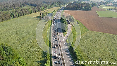 AERIAL: People driving their cars down highway get stuck in a traffic congestion Stock Photo