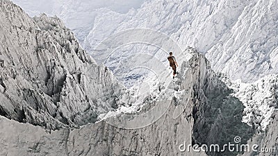 Aerial perspective of hiker standing on peak in snow. Stock Photo