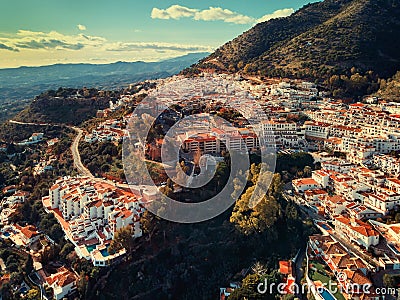 Aerial photo distant view charming Mijas pueblo, typical Andalusian white-washed mountain village Stock Photo