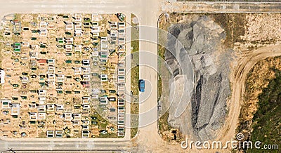 Aerial photo of new cemetery graveyard showing the headstones and tombstones of the graves some are with flowers long shadows from Stock Photo