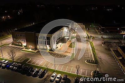 Aerial photo office building and parking lot at night Stock Photo