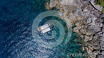 Aerial photo of people snorkeling in tropical Coral reef Stock Photo