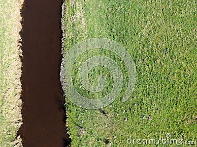 Aerial photo of a small river by meadows, abstract photo Stock Photo