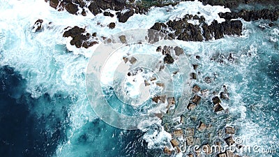 Aerial photo of strong and powerful ocean with huge waves. Rocks Stock Photo