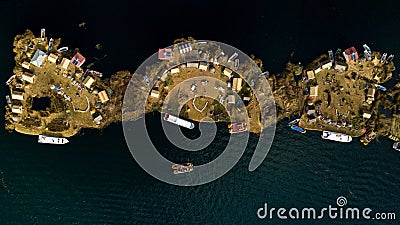 Aerial photo of three floating islands on Lake Titicaca in Peru Stock Photo