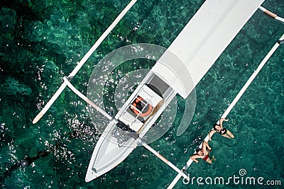 Aerial photo of young couple on holidays swimming in ocean Stock Photo