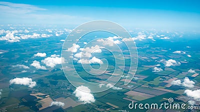 Aerial photograph of a pattern of fields, valleys and villages with cloud sky taken out of an aeroplane Stock Photo
