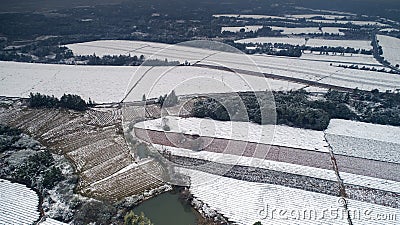 Aerial photography of the snowy scenery of ten thousand mu tea garden in Xuancheng, Anhui Province, China Stock Photo