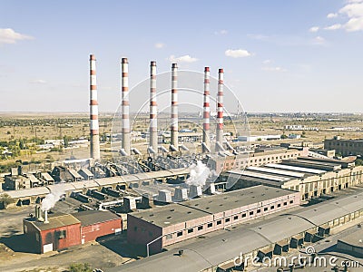 Aerial power electrical plant with high industrial pipes on a summer day f Stock Photo