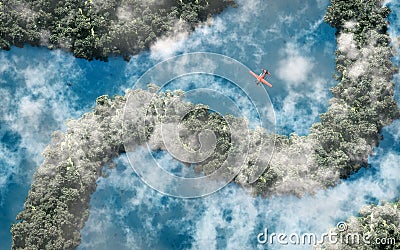 Aerial of red airplane flying over rainforest with river and clouds. Stock Photo