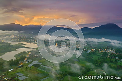 Aerial scenery of fog above village on morning Stock Photo