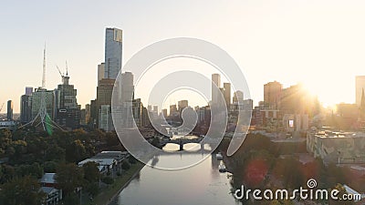 AERIAL. Scenery sunset in Melbourne downtown, above Yarra river Stock Photo