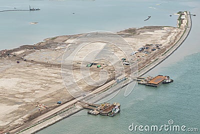 aerial shoot of a lake coast with sand mining Stock Photo