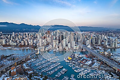 Aerial shot of the beautiful Vancouver city in Canada with many skyscrapers during the winter Stock Photo