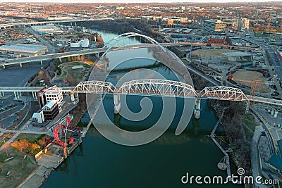 Aerial shot Cumberland River with the John Seigenthaler Pedestrian Bridge and the Korean Veterans Memorial Bridge over the water Stock Photo