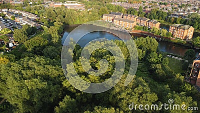 Aerial shot of a large canal in a green landscape during the day Stock Photo