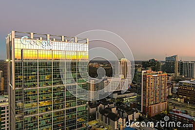 aerial shot of office buildings, skyscrapers in the city skyline at sunset with cars driving on the freeway in Atlanta Georgia Editorial Stock Photo