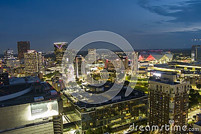 aerial shot of skyscrapers, hotels, office buildings in the city skyline at sunset with the SkyView Atlanta Ferris wheel Editorial Stock Photo