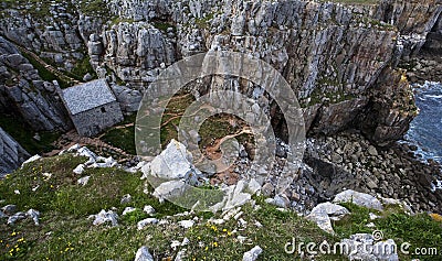 Aerial shot of st govan's chapel (tiny church) built on the cliff Stock Photo