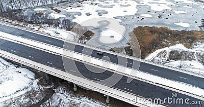 Aerial snowy bridge winter road white frozen lakes Stock Photo