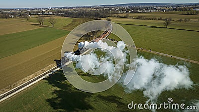 Aerial of a Steam Double-Header Freight , Passenger Combo Train Approaching Blowing Lots of Smoke Editorial Stock Photo