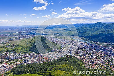 Aerial summer city on mountain valley Stock Photo