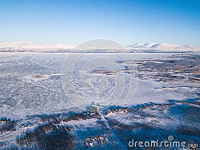 Aerial sunny winter view of Abisko National Park, Kiruna Municipality, Lapland, Norrbotten County, Sweden, shot from drone, with r Stock Photo