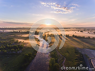 Aerial sunrise with fog at the tree tops in the rural countryside Stock Photo