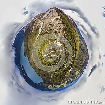 Aerial tiny planet of path heading on top of mountain Stock Photo