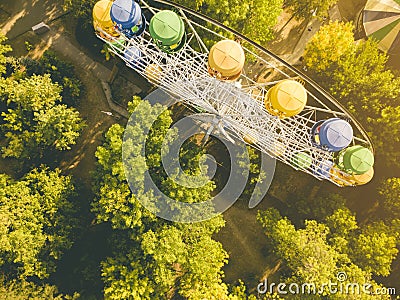 Aerial top directly above view of ferris wheel in summer amusement public city park, drone shot d Stock Photo