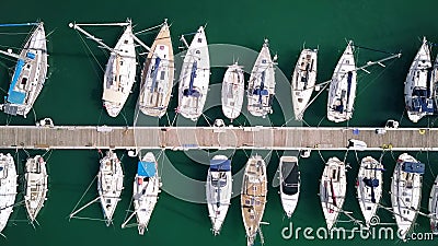 Aerial top-down view of docked sailboats at marina Stock Photo